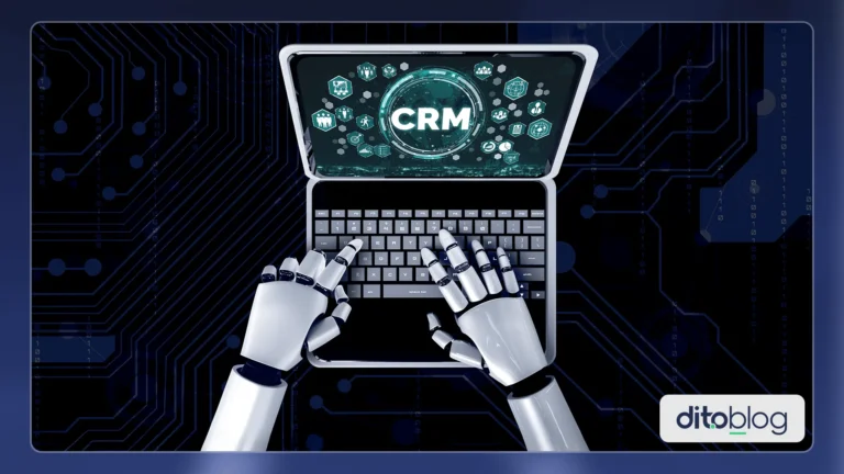 Mãos de robô usando um notebook que apresenta na tela a palavra CRM.